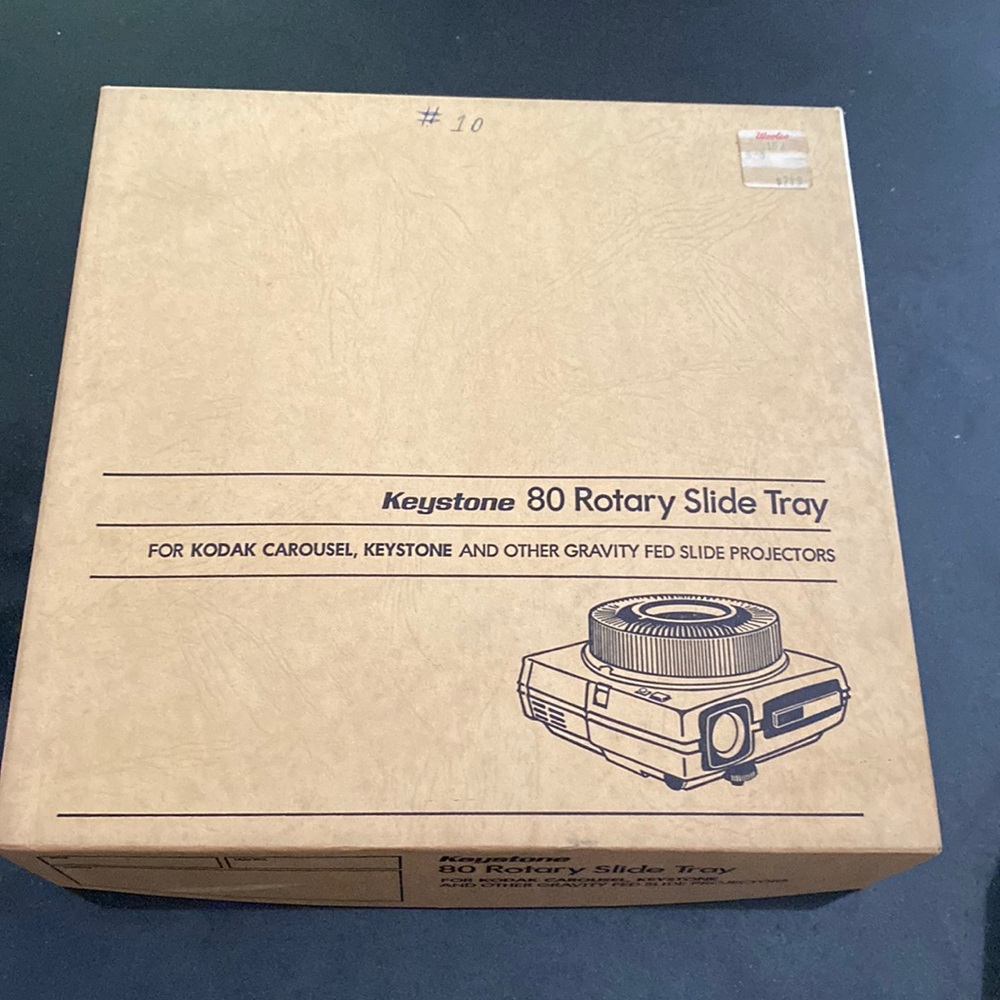 80 rotary slide tray from Keystone antique has a sticker on it from Woolco